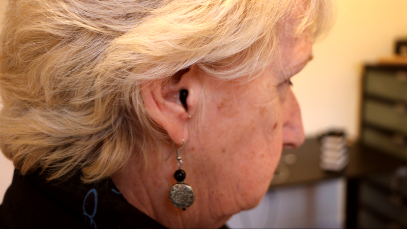 The hearing aids are virtually invisible.